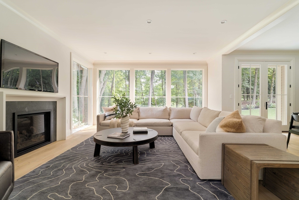 14 Bird Hill Avenue Wellesley, MA 02481 - Photo 21 of 37 a living room with furniture and a fireplace