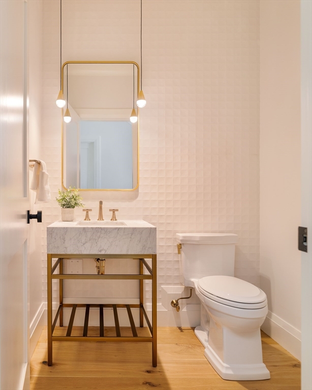 14 Bird Hill Avenue Wellesley, MA 02481 - Photo 23 of 37 a bathroom with a toilet a sink and mirror