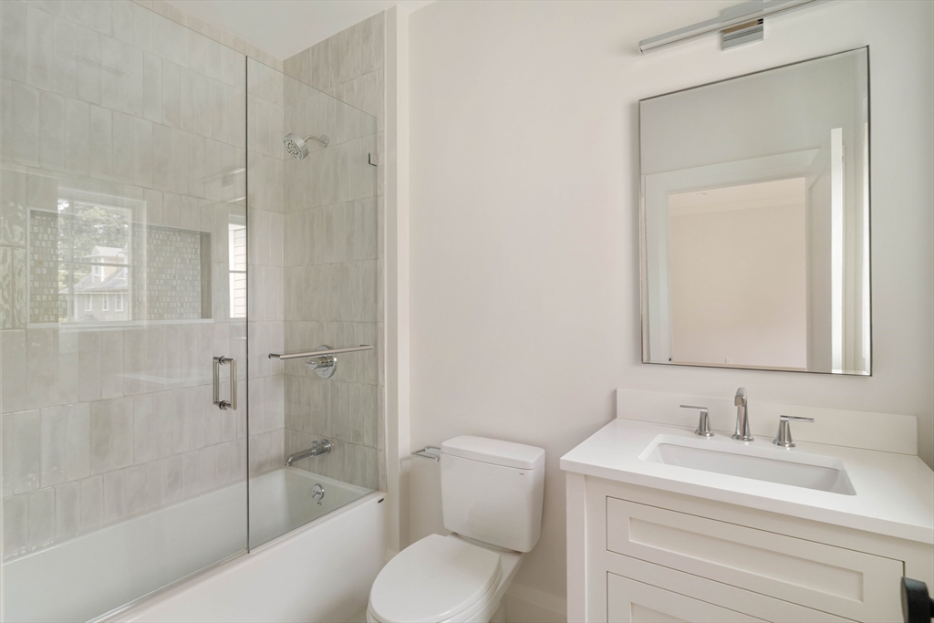 14 Bird Hill Avenue Wellesley, MA 02481 - Photo 30 of 37 a bathroom with a granite countertop sink toilet and shower
