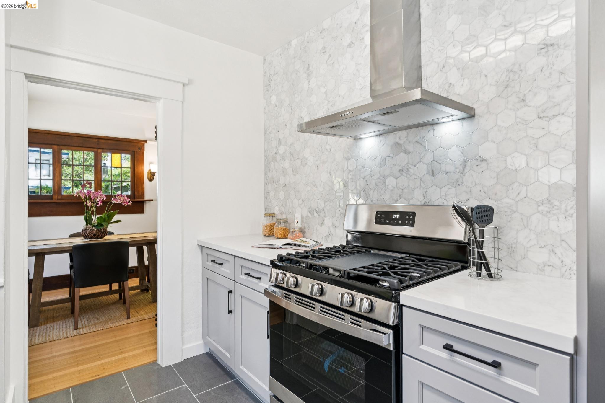 2320 Derby Street Berkeley, CA 94705 - Photo 13 of 39 a kitchen with stainless steel appliances granite countertop a stove and a cabinets