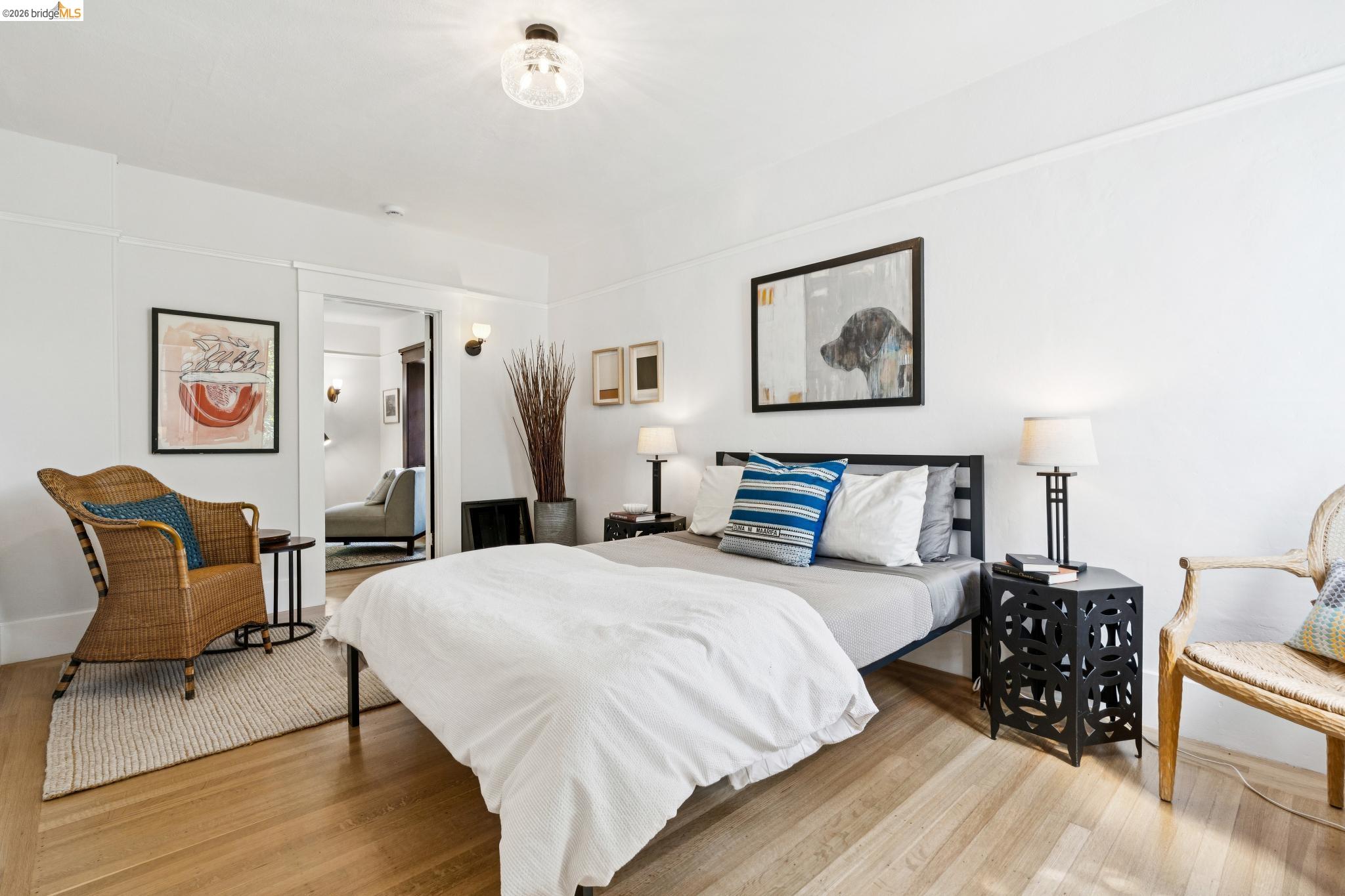 2320 Derby Street Berkeley, CA 94705 - Photo 14 of 39 a bedroom with a bed and wooden floor