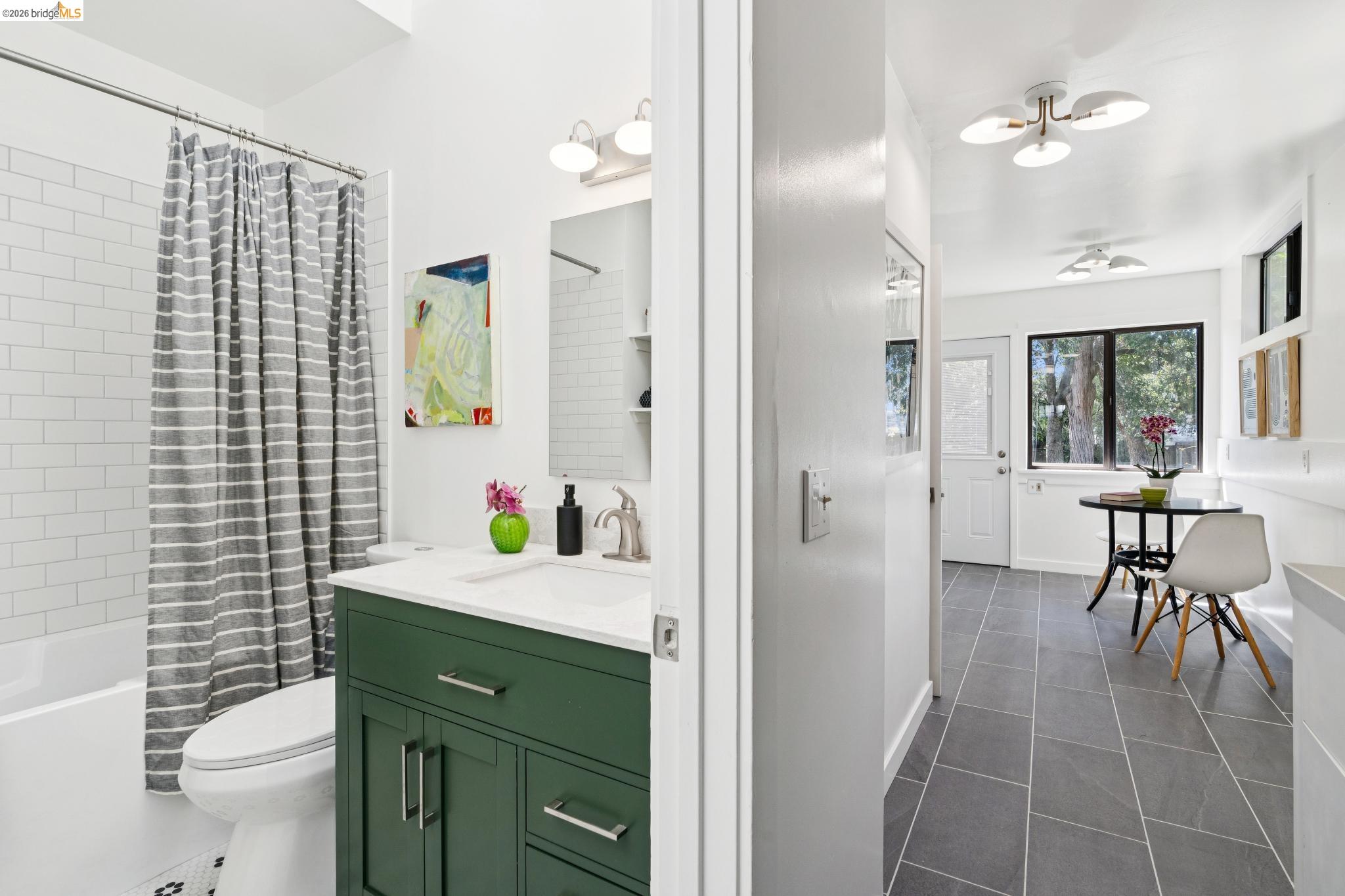 2320 Derby Street Berkeley, CA 94705 - Photo 16 of 39 a bathroom with a sink a toilet and shower