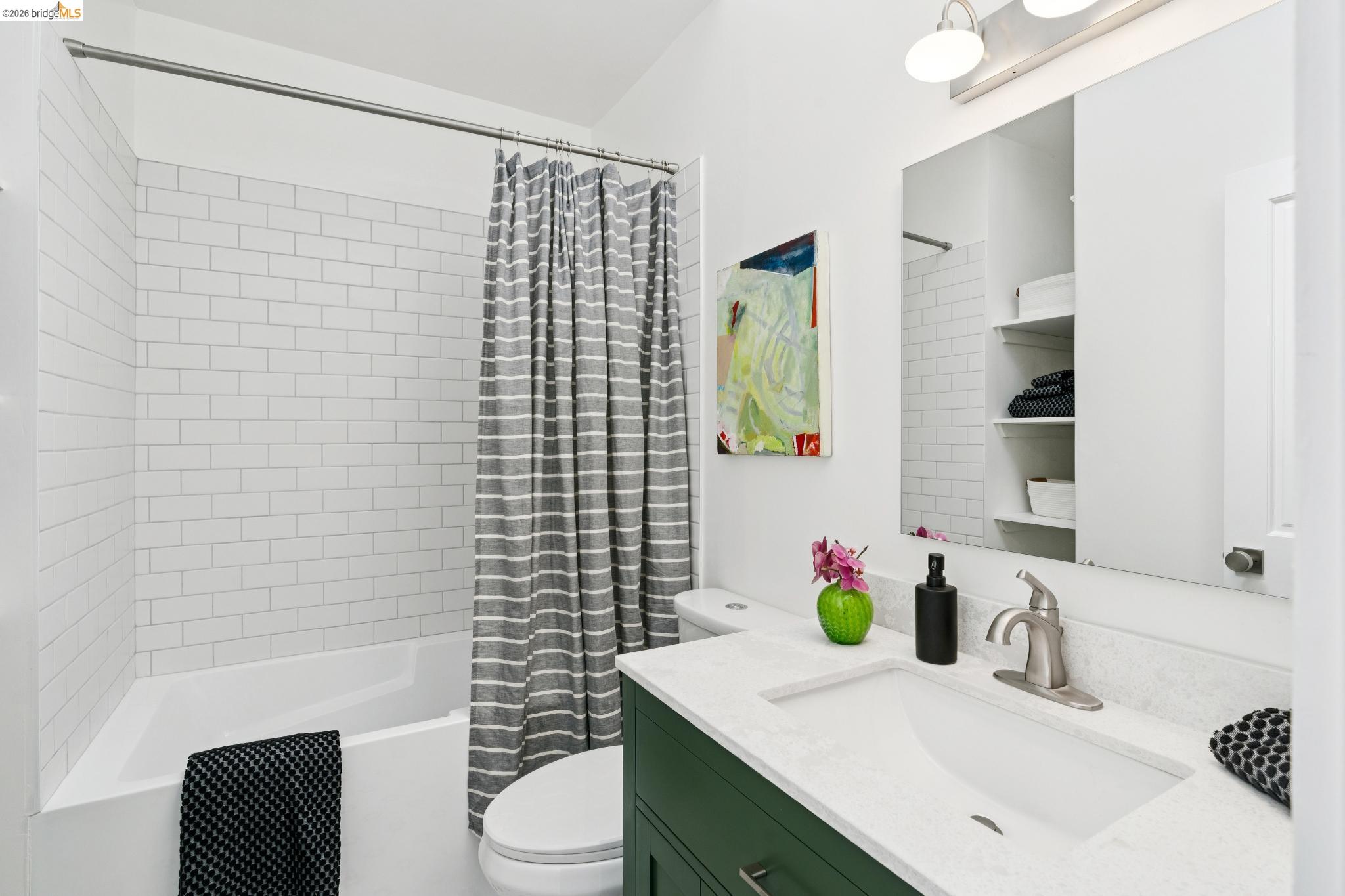 2320 Derby Street Berkeley, CA 94705 - Photo 17 of 39 a bathroom with a sink toilet and shower