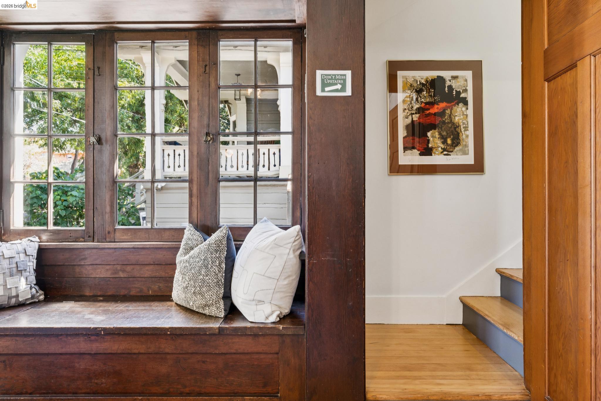 2320 Derby Street Berkeley, CA 94705 - Photo 21 of 39 a living room with furniture and a floor to ceiling window