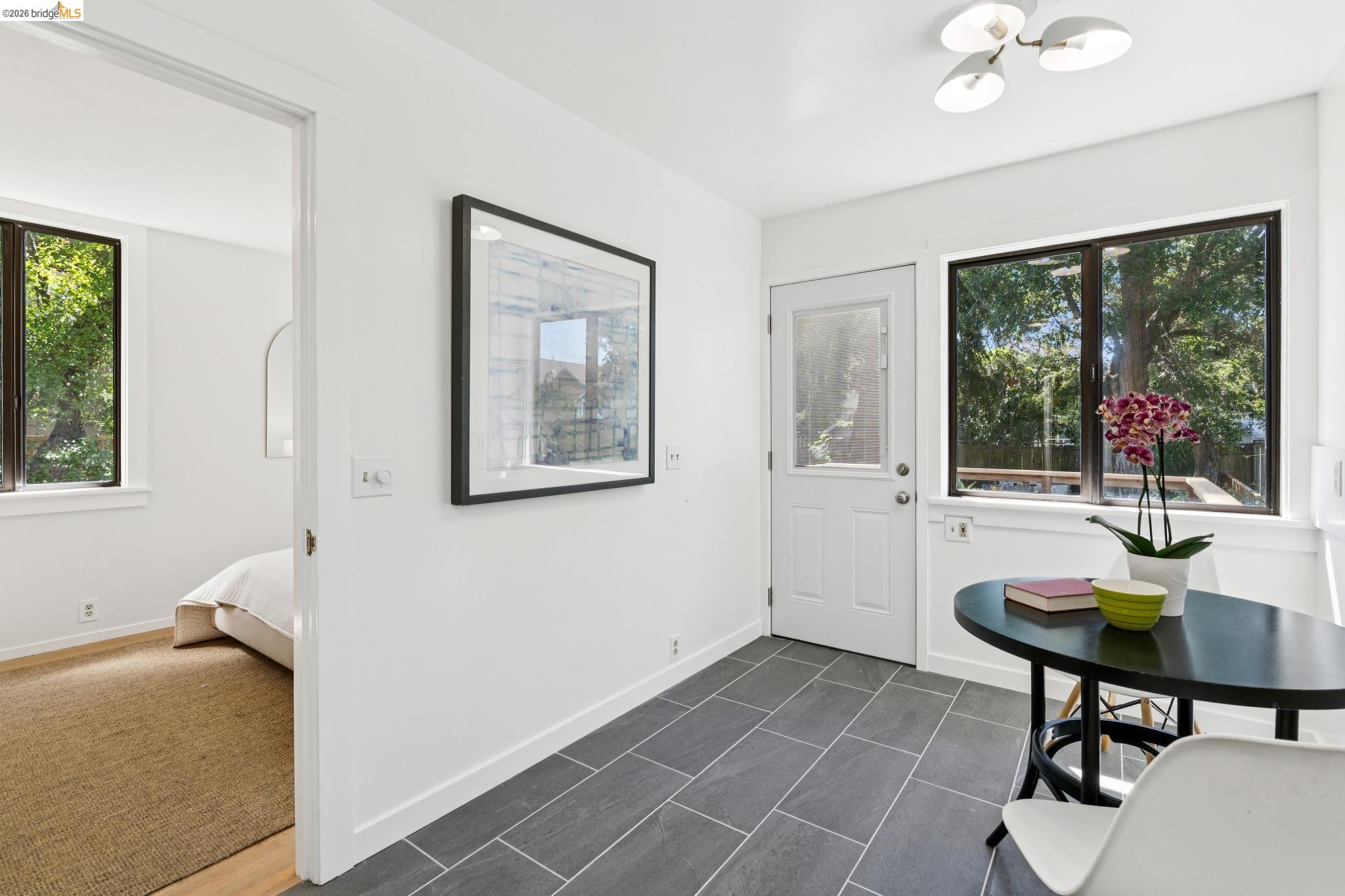 2320 Derby Street Berkeley, CA 94705 - Photo 28 of 39 a view of a dining room with furniture window and outside view