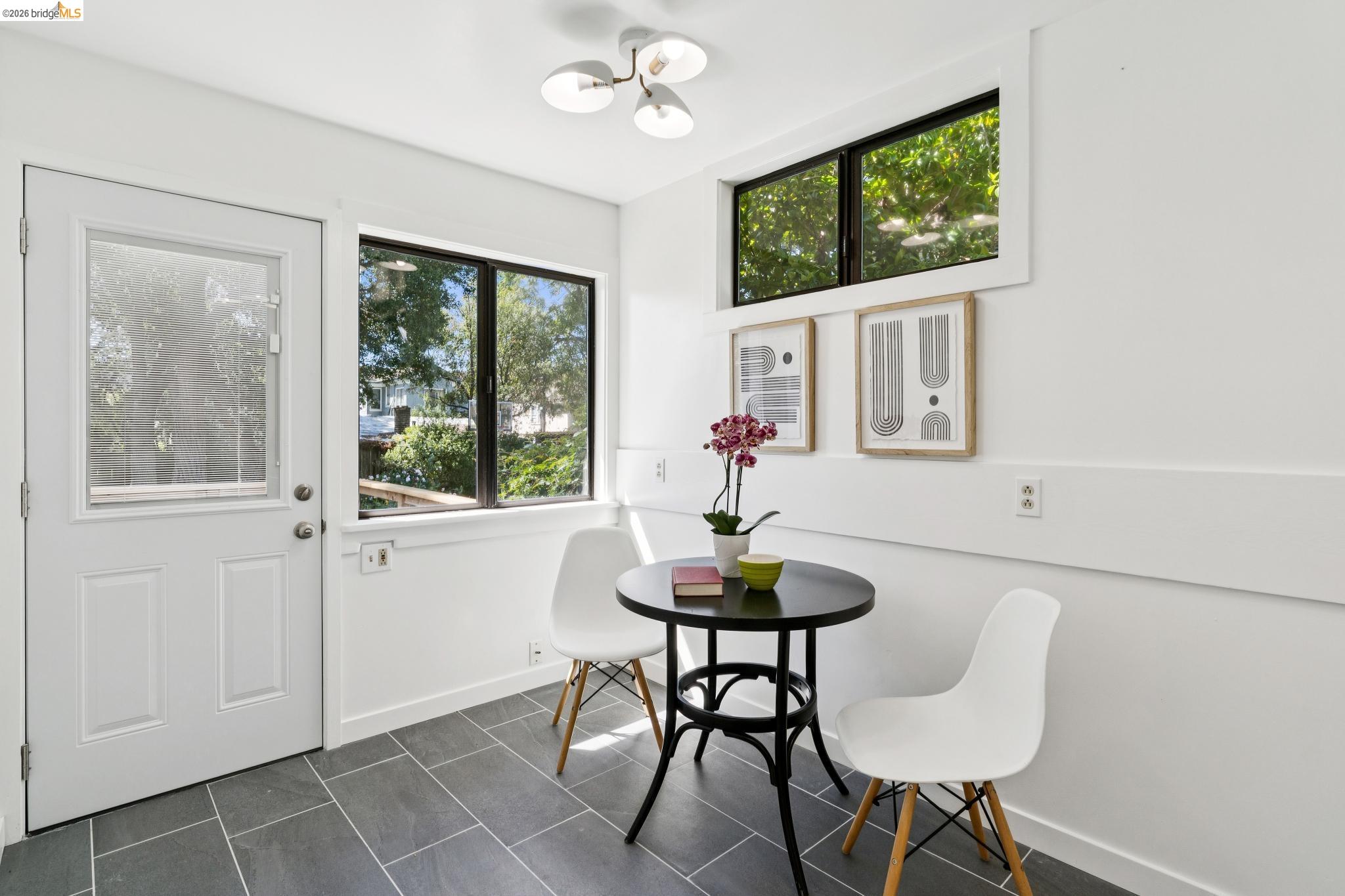 2320 Derby Street Berkeley, CA 94705 - Photo 29 of 39 a view of a dining room with furniture window and outside view