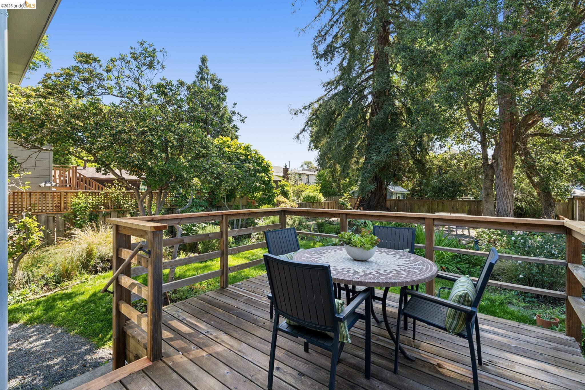 2320 Derby Street Berkeley, CA 94705 - Photo 30 of 39 a view of chair and table on the deck