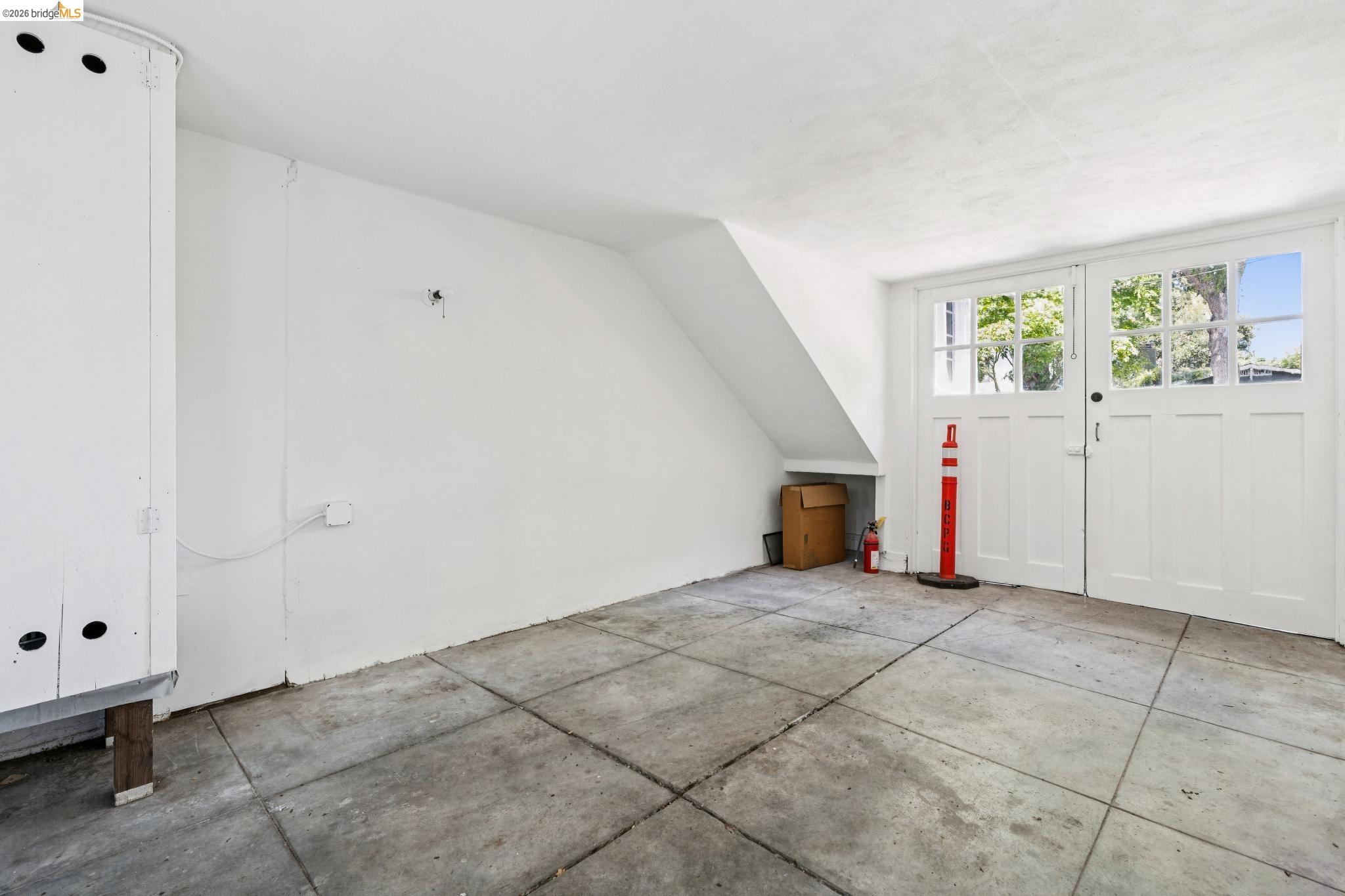 2320 Derby Street Berkeley, CA 94705 - Photo 38 of 39 a view of a livingroom with an empty space and a window