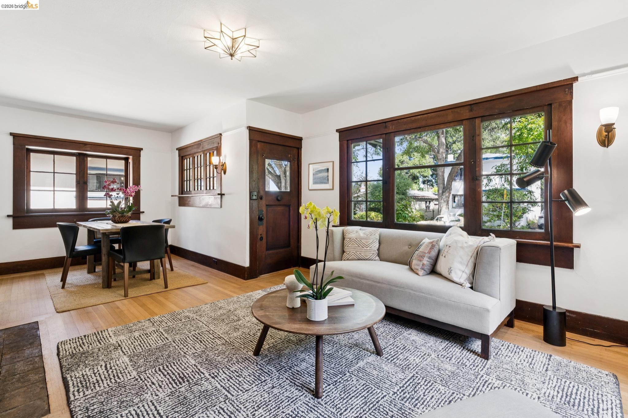 2320 Derby Street Berkeley, CA 94705 - Photo 7 of 39 a living room with furniture a table and a large window