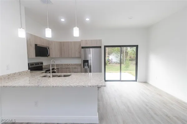 a large kitchen with a large window