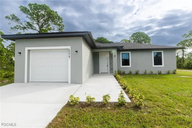 a house with garden in front of it