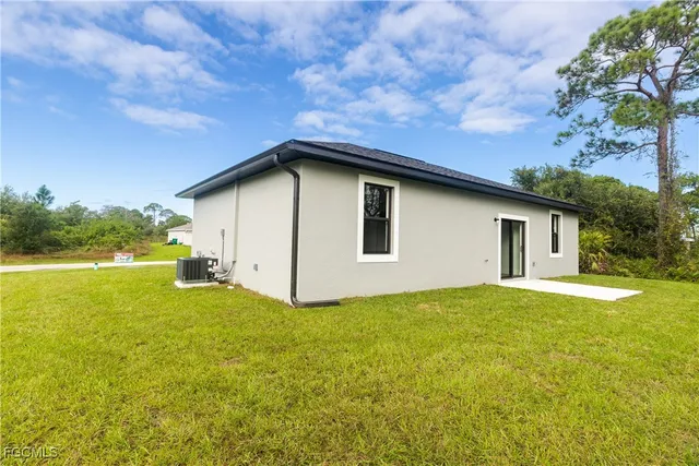 a house with swimming pool in front of it