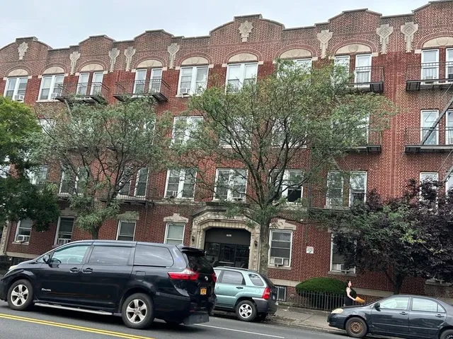 a view of a car parked in front of a building