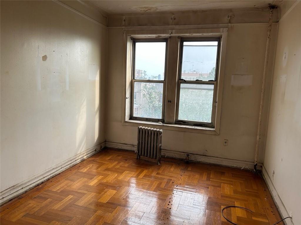 1961 65th Street, Unit 3B Brooklyn, NY 11204 - Photo 4 of 4 an empty room with wooden floor and windows