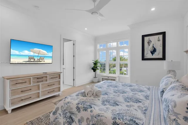 a large white bed in a white room