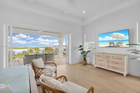 a bedroom with a bed and glass window