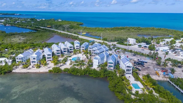 an aerial view of a house with outdoor space