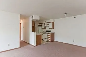 a view of kitchen and refrigerator