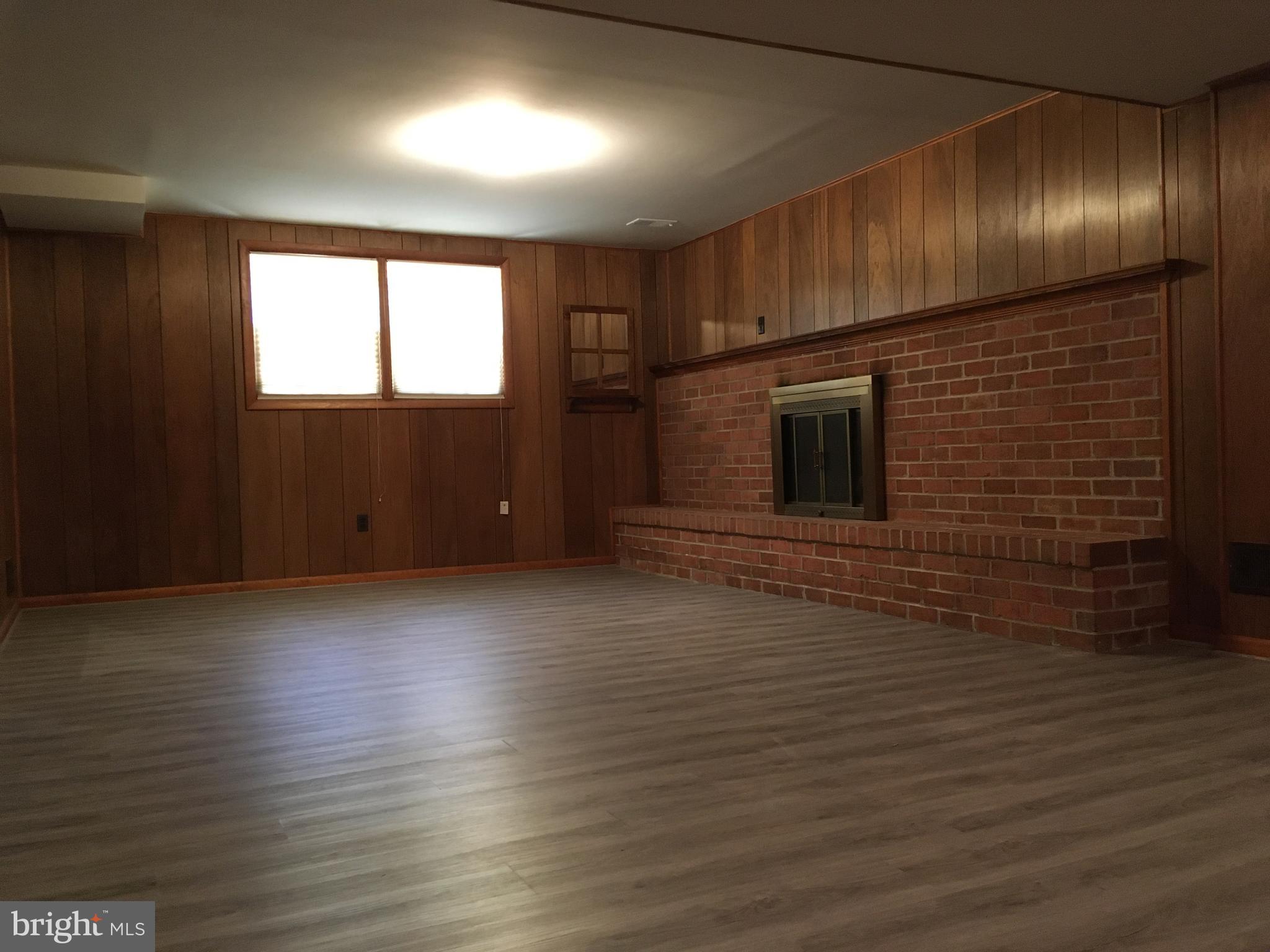 7020 Redmiles Road Laurel, MD 20707 - Photo 15 of 19 Rec Room/Brick Fireplace