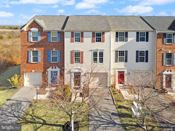 a front view of a house with many windows