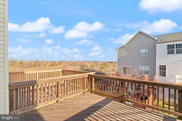 a bathroom with a sink vanity mirror and toilet