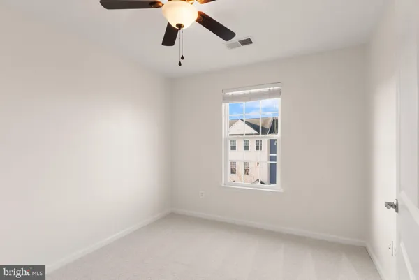 a view of a house with backyard and porch