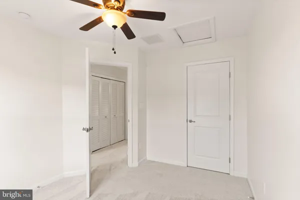 a view of a house with wooden fence