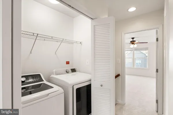 a aerial view of a house with swimming pool outdoor seating