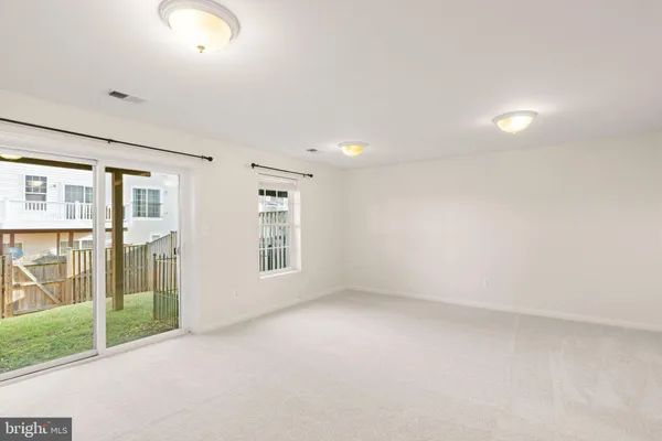 a view of backyard with a garden and outdoor seating