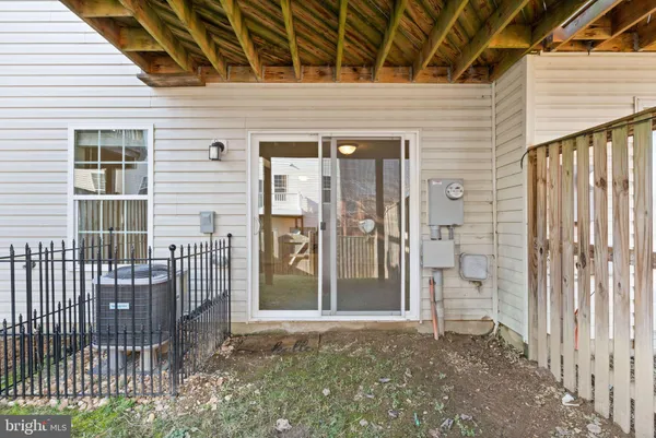 an aerial view of a house with a garden and lake view