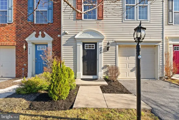 a view of a room with wooden floor and bathroom