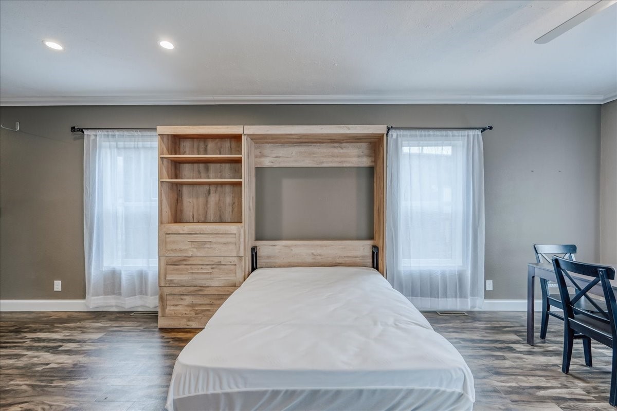 847 Airport Road, Unit 21 Breckenridge, CO 80424 - Photo 14 of 35 a bedroom with a bed and chair