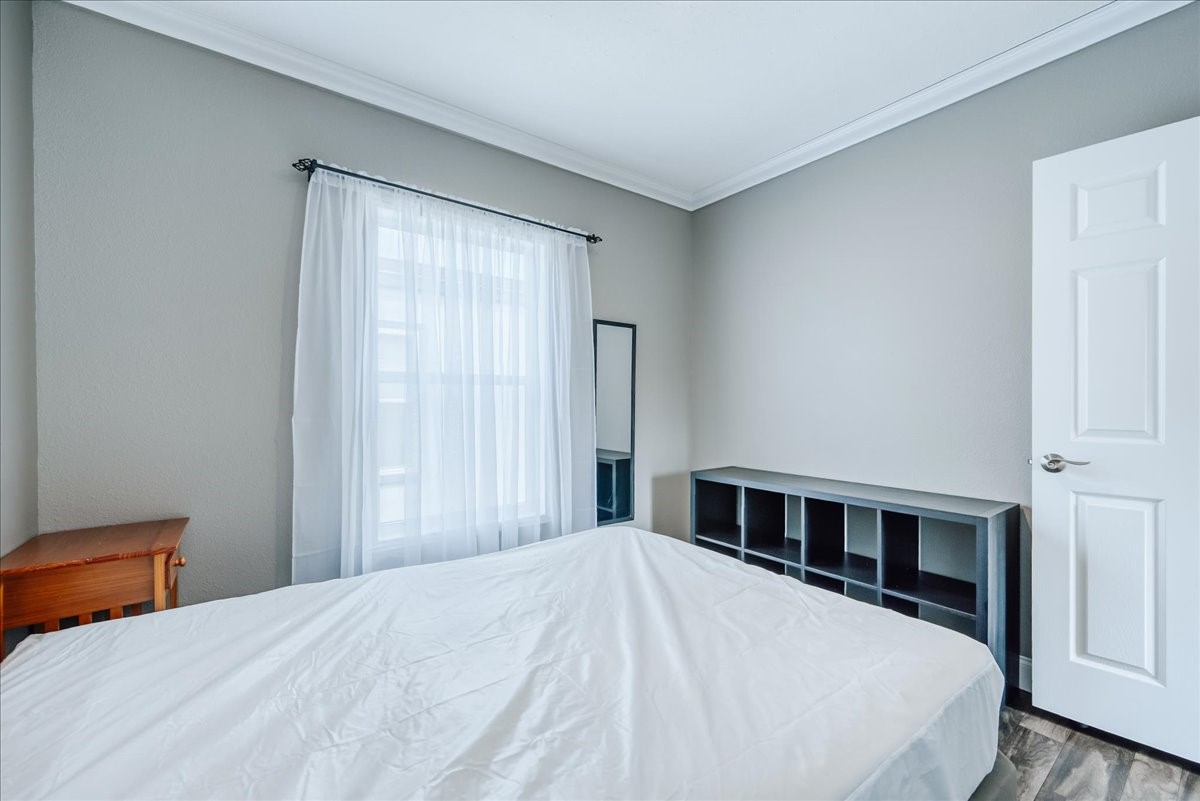 847 Airport Road, Unit 21 Breckenridge, CO 80424 - Photo 17 of 35 a bedroom with a large bed and a window