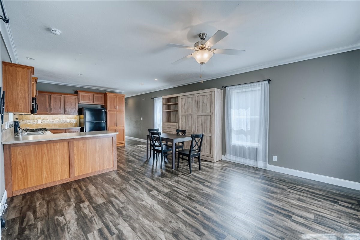 847 Airport Road, Unit 21 Breckenridge, CO 80424 - Photo 3 of 35 a kitchen with stainless steel appliances granite countertop a stove top oven a sink with dining table and chairs