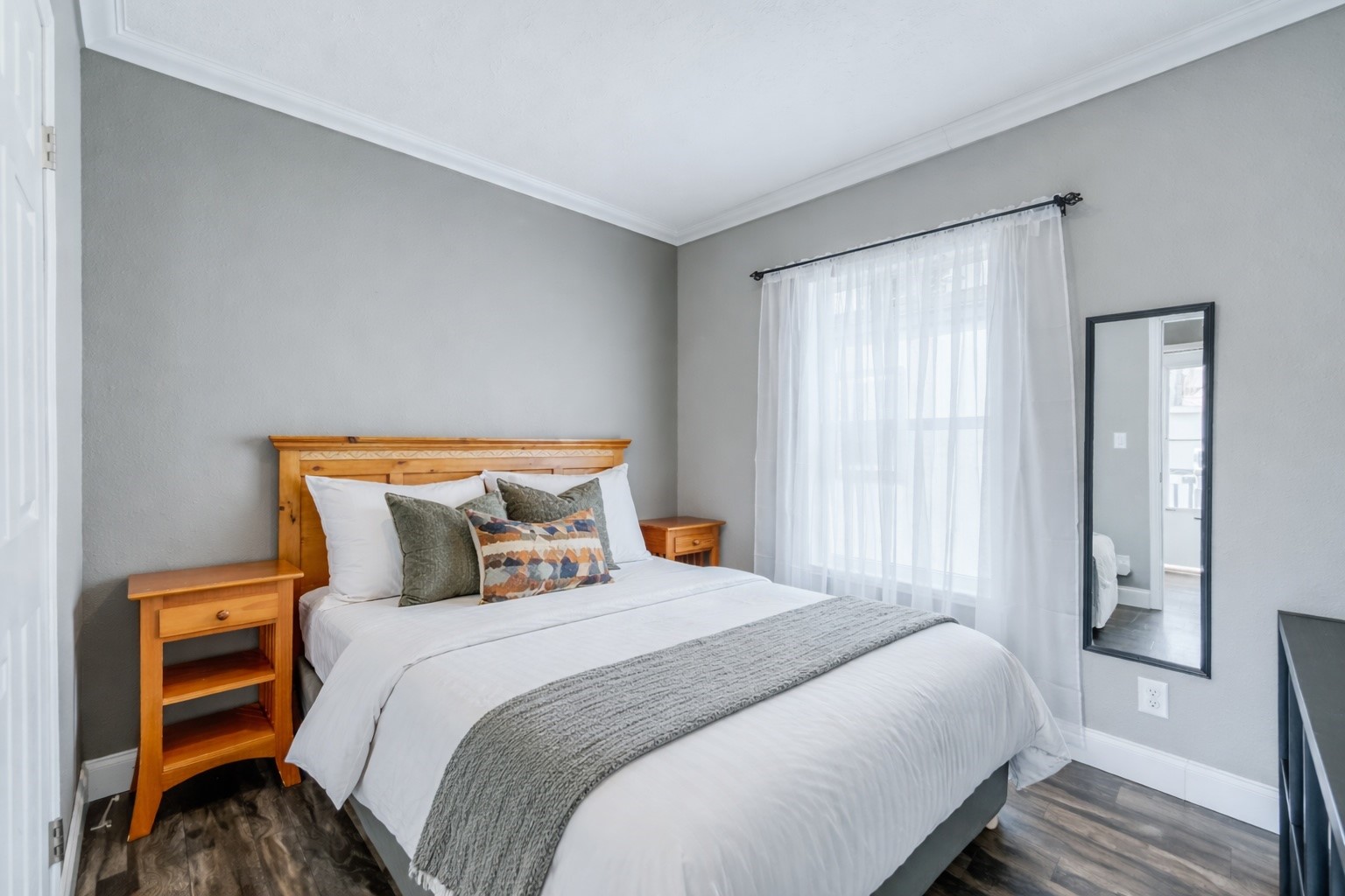 847 Airport Road, Unit 21 Breckenridge, CO 80424 - Photo 6 of 35 a bedroom with a bed and wooden floor