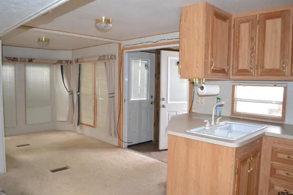 a bathroom with a sink a mirror and a shower