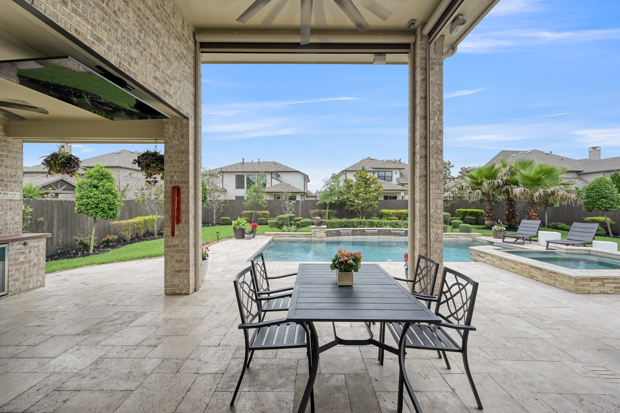 25015 Karacabey Court Spring, TX 77389 - Photo 46 of 49 Covered patio if the sun is not your thing. Automatic shades help keep the temps down and the sun at bay.