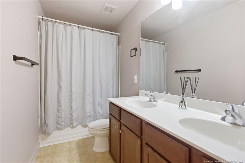 334 Crane Way Bunnlevel, NC 28323 - Photo 24 of 45 a bathroom with a sink toilet and shower