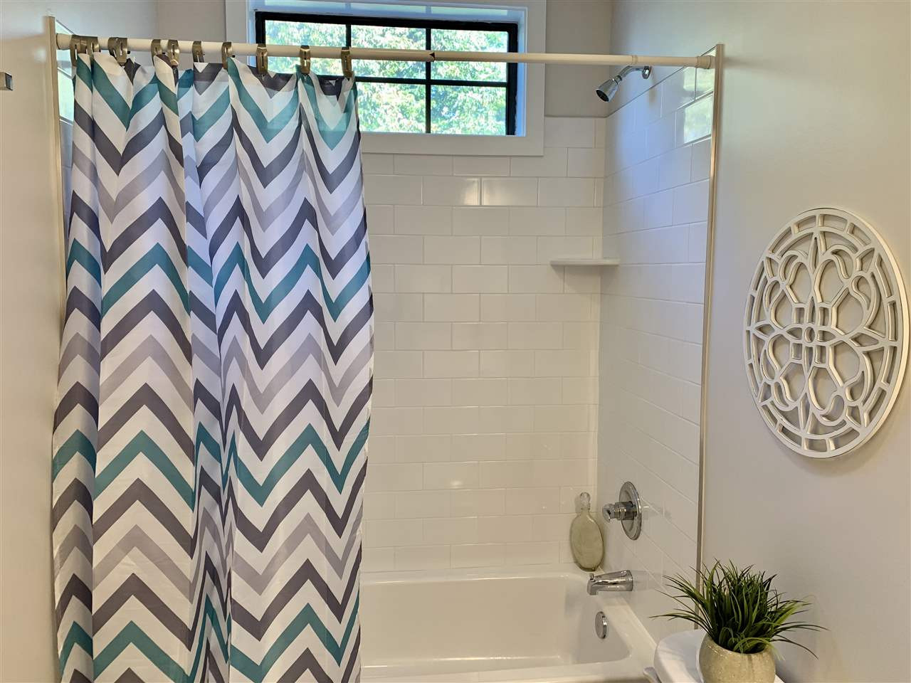 3803 Chimney Ridge Place, Unit 207 Durham, NC 27713 - Photo 20 of 27 The Bathroom features a Tile Surround Bath/Shower. This is the only original window. All the other windows were replaced. Bathroom