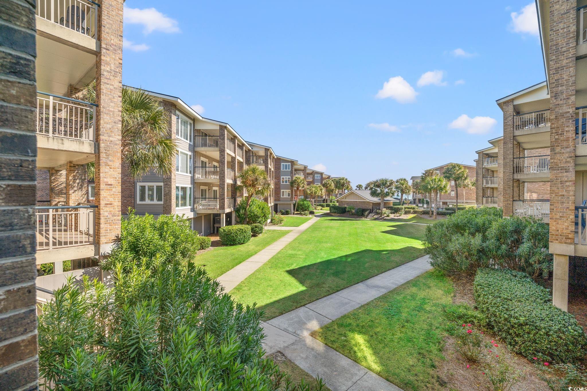 320 Myrtle Avenue Pawleys Island, SC 29585 - Photo 11 of 38 View of home's community with a yard