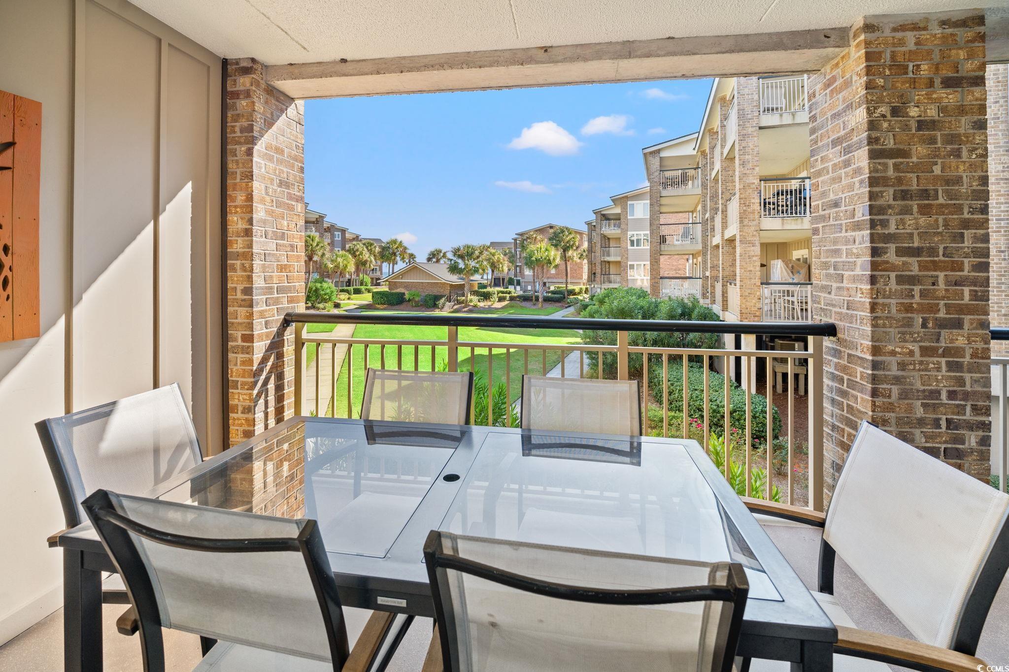 320 Myrtle Avenue Pawleys Island, SC 29585 - Photo 33 of 38 Balcony with outdoor dining area