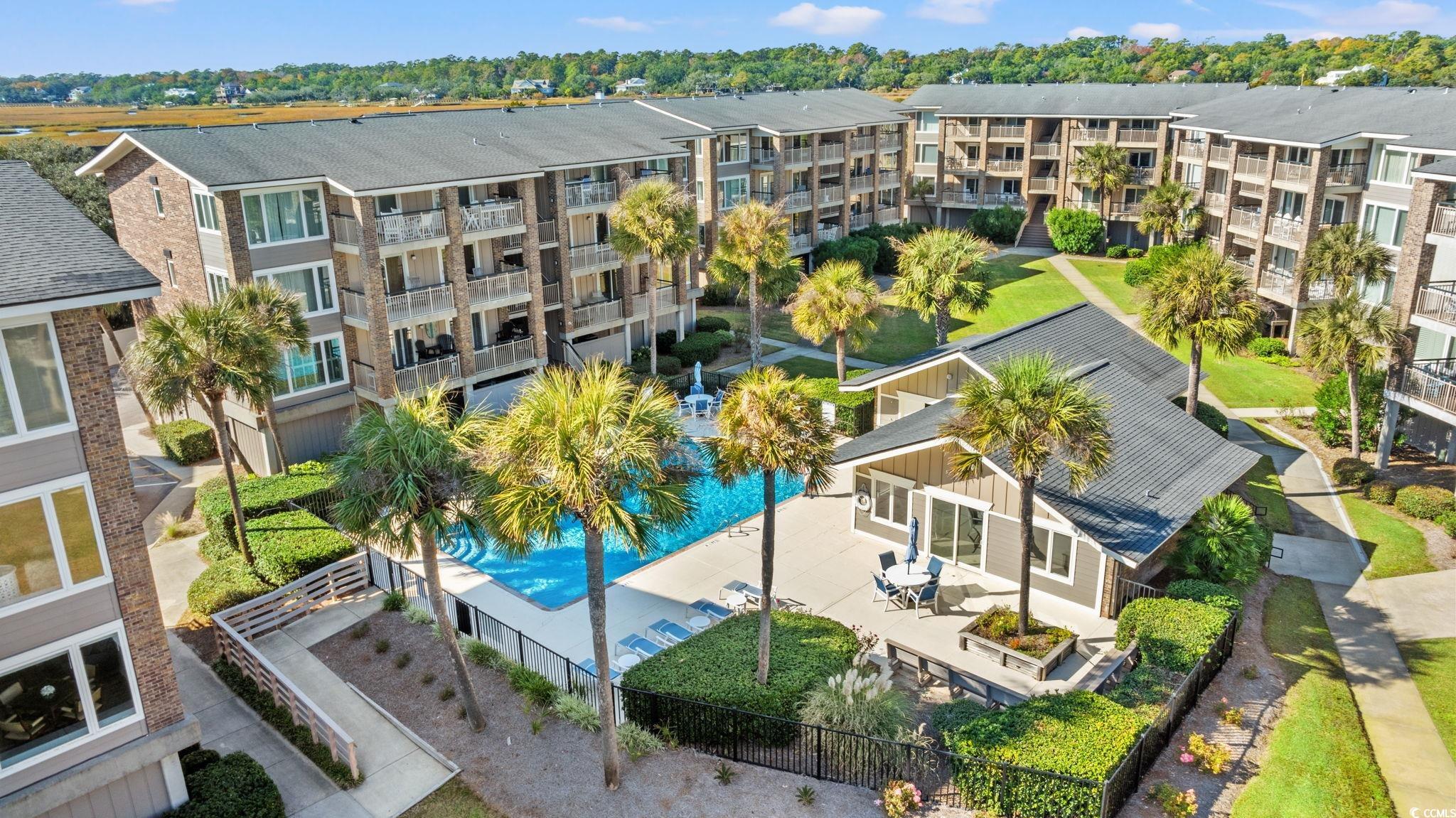 320 Myrtle Avenue Pawleys Island, SC 29585 - Photo 8 of 38 Drone / aerial view of apartment complex and a pool