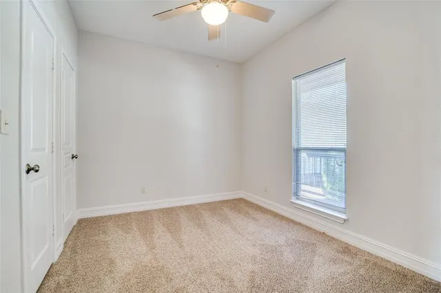 a spacious bathroom with a granite countertop sink mirror and