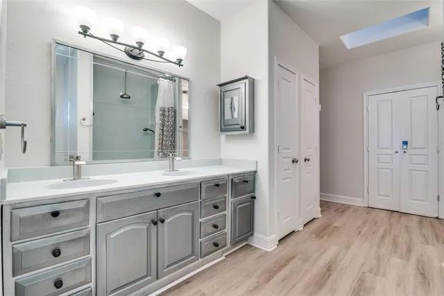 a view of a porch with wooden floor and iron stairs