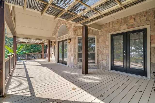 a view of a hallway with windows