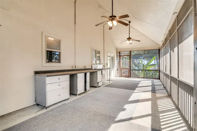 a view of a house with wooden fence