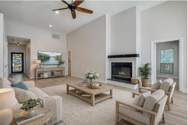 a living room with furniture and a fireplace