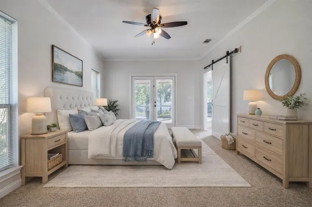 a bedroom with a bed a lamp and window