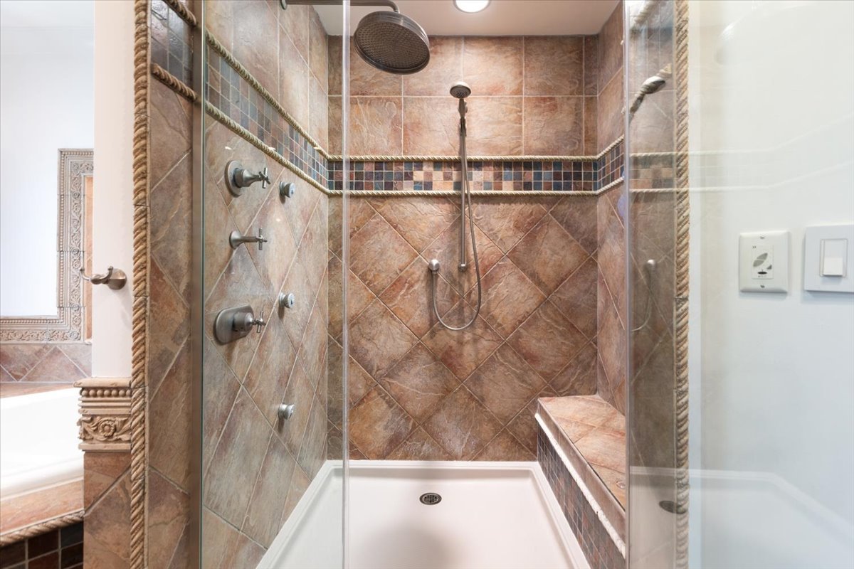 23 Columbia Street Naperville, IL 60540 - Photo 50 of 94 a bathroom with a shower and a tub