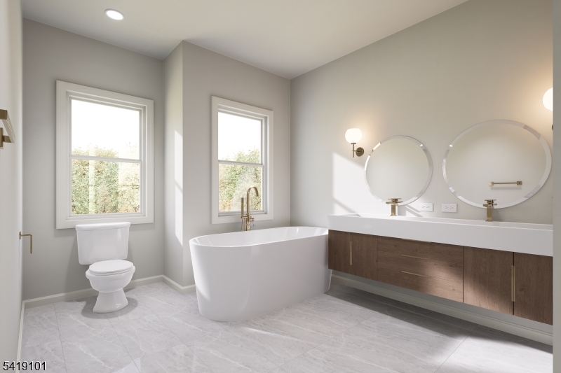 755 River Road Chatham, NJ 07928 - Photo 18 of 24 a bathroom with a double vanity sink a mirror and a bathtub